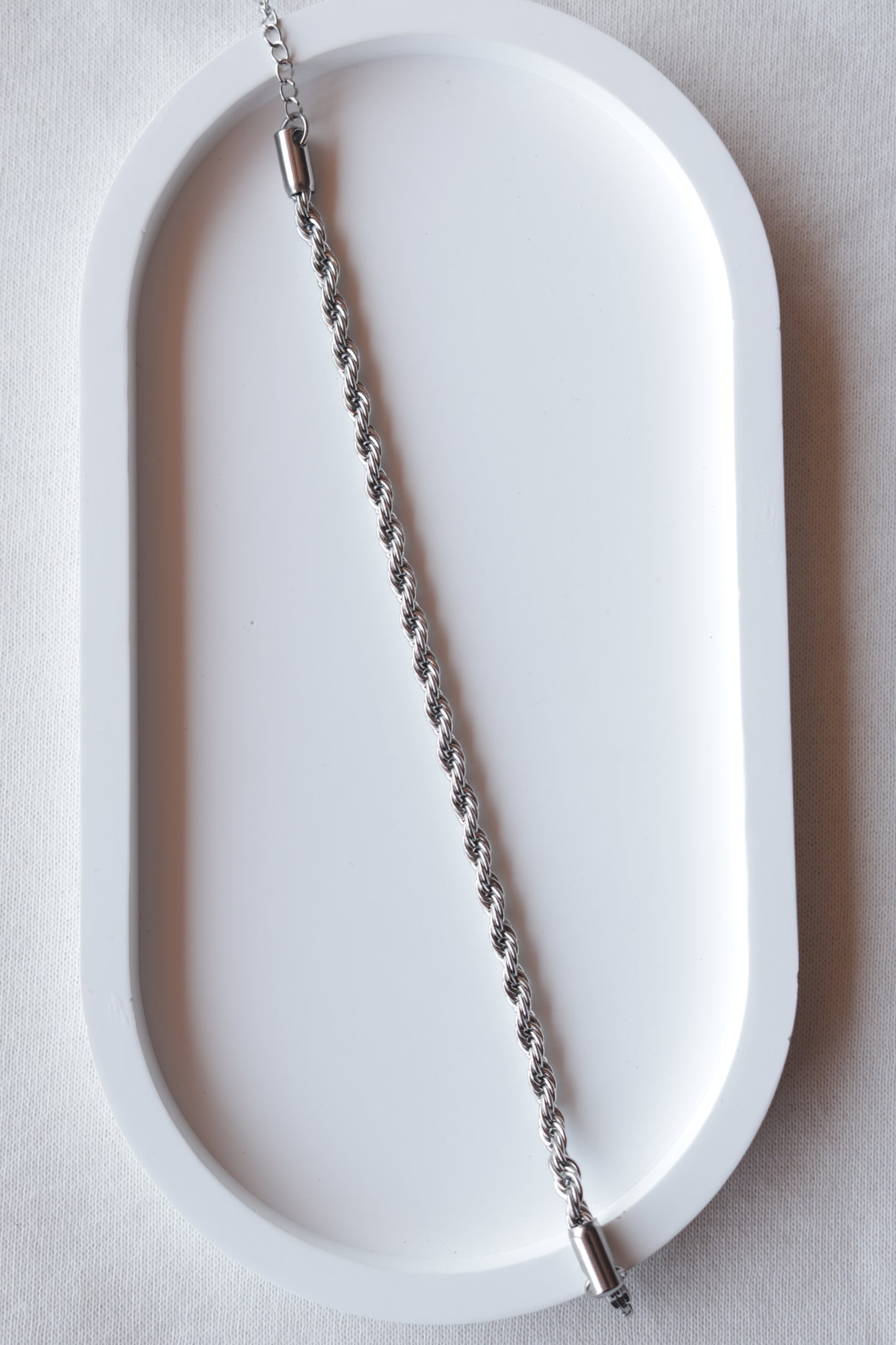 Pulseira de Aço Prateado Entrelaçado