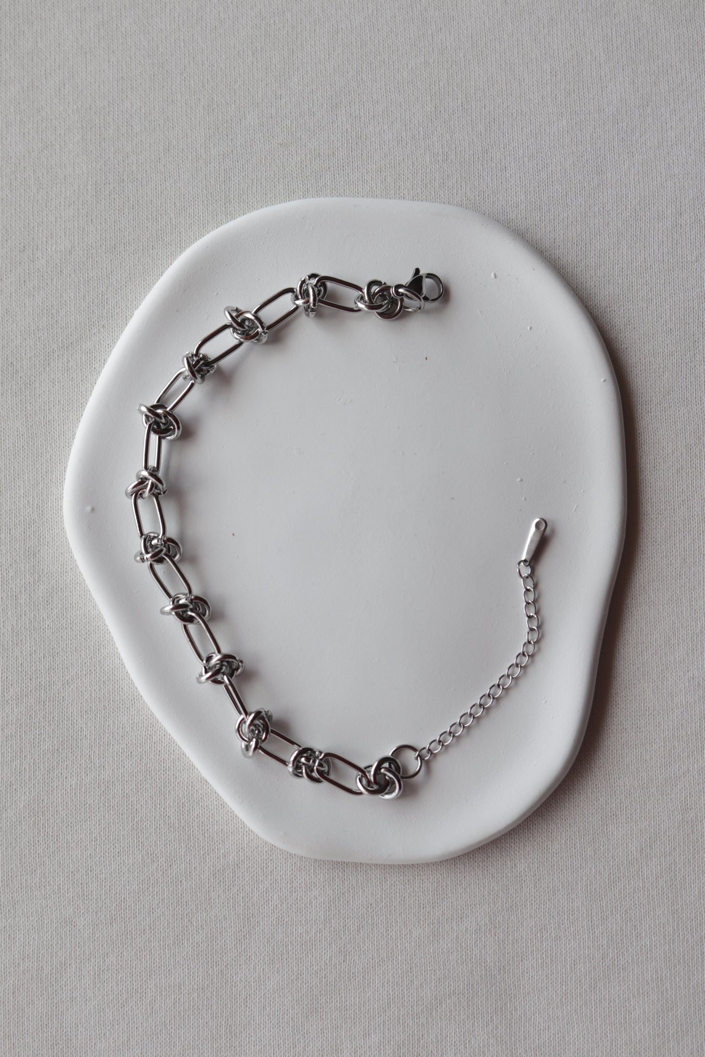 Pulseira de Aço Prateado de Nós