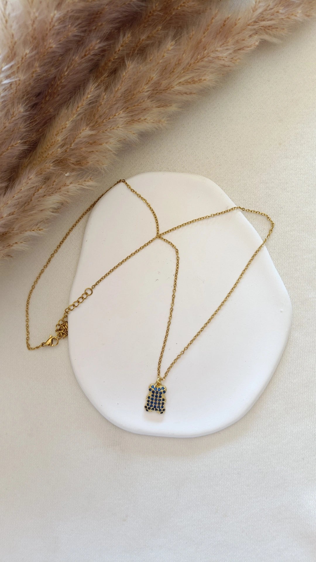 Colar de Aço Dourado de Urso com Brilhantes Azuis