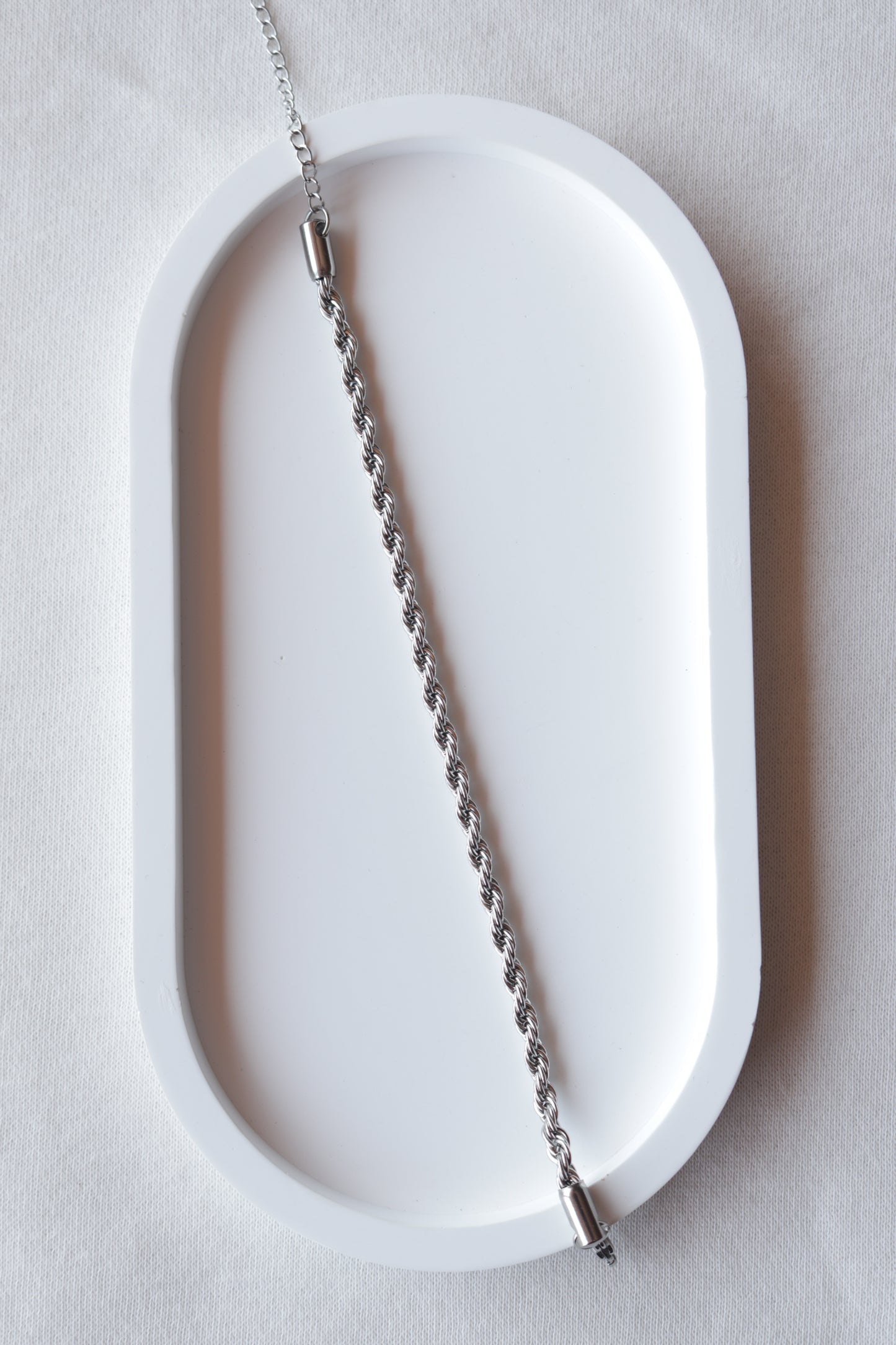 Pulseira de Aço Prateado Entrelaçado