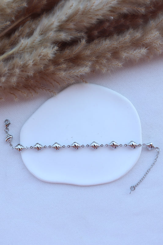 Pulseira de Aço Prateado de Pé de Búzios
