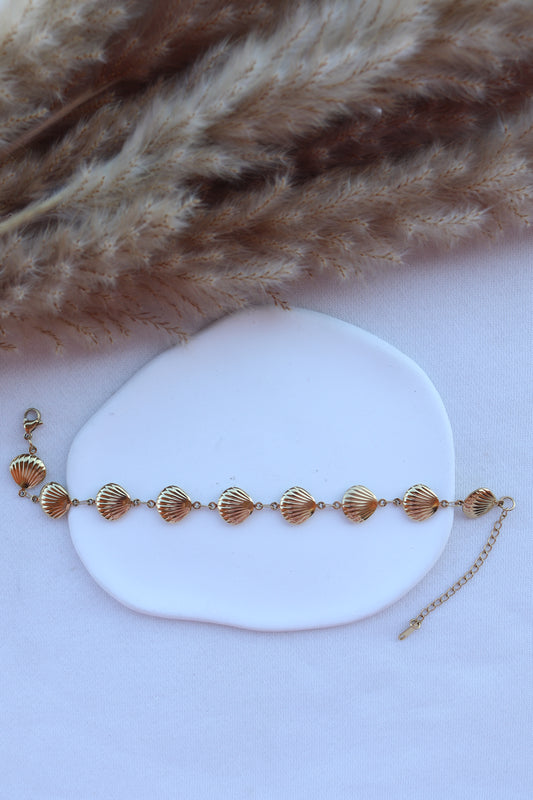 Pulseira de Aço Dourado de Pé de Conchas