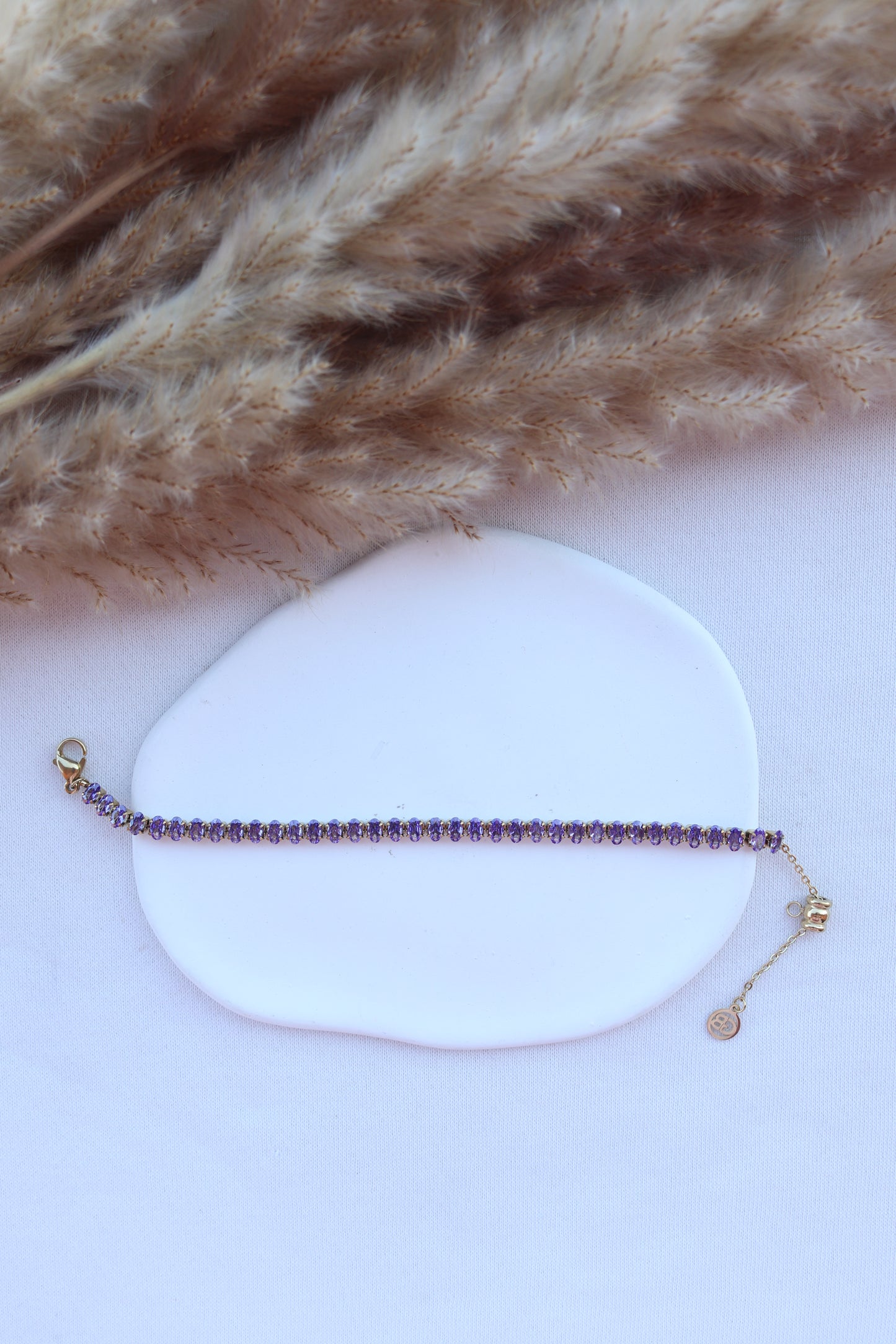 Pulseira de Aço Dourado Inspiração Swarovski com Zircônias Roxas
