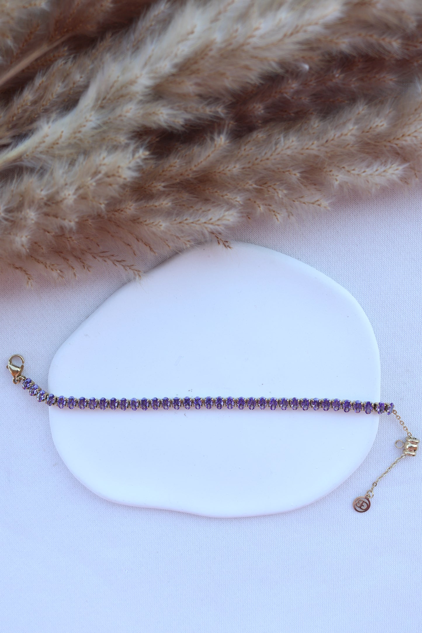 Pulseira de Aço Dourado Inspiração Swarovski com Zircônias Roxas
