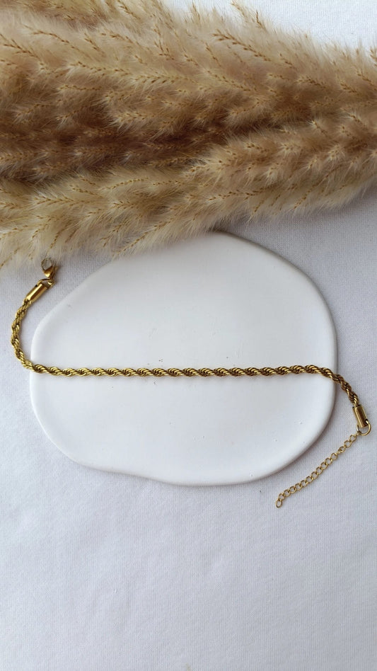 Pulseira de Aço Dourado de Pé Entrelaçada