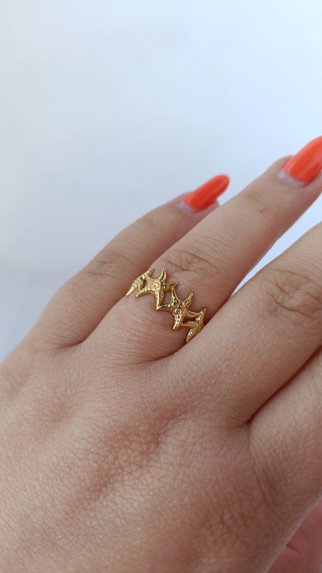 Anel de Aço Dourado com Várias Estrelas do Mar