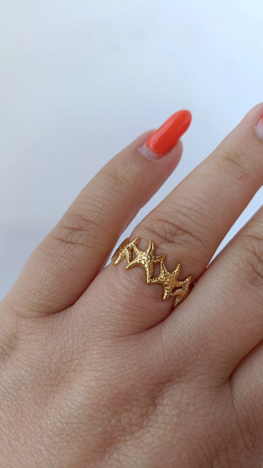 Anel de Aço Dourado com Várias Estrelas do Mar