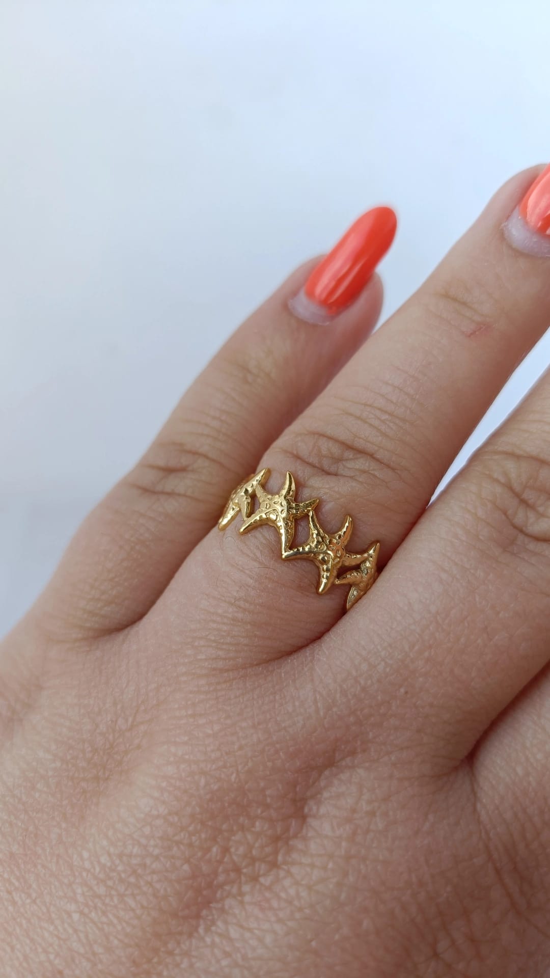 Anel de Aço Dourado com Várias Estrelas do Mar