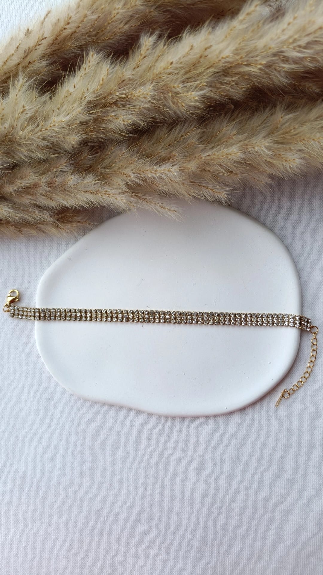 Pulseira de Aço Dourado Tripla com Brilhantes