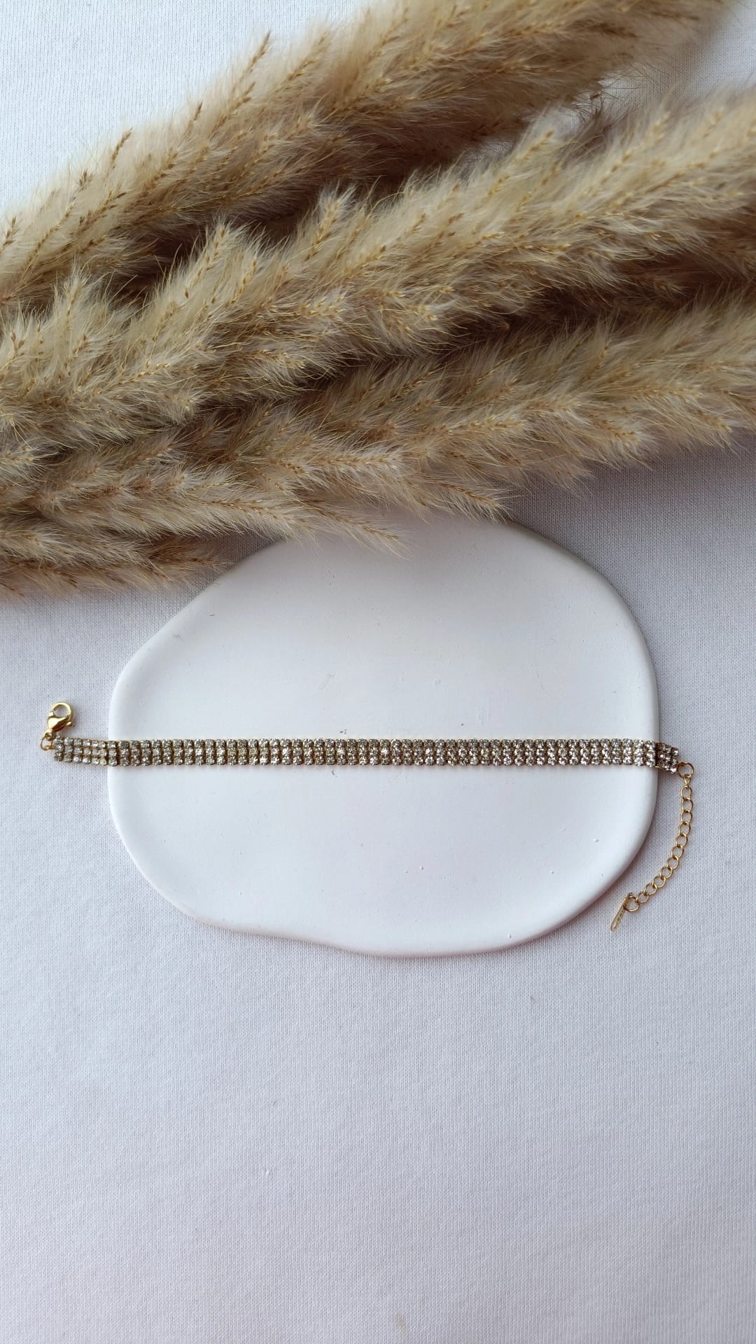 Pulseira de Aço Dourado Tripla com Brilhantes