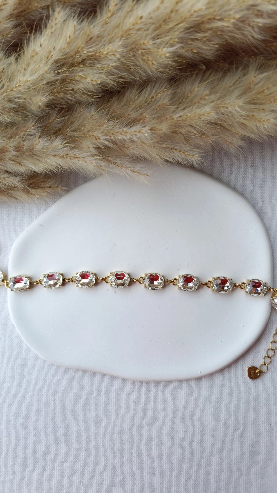 Pulseira de Aço Dourado com Zircônias Ovais