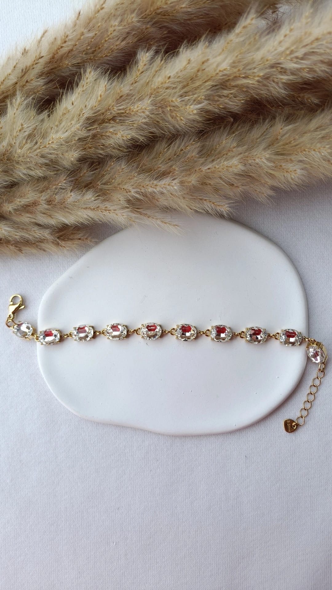 Pulseira de Aço Dourado com Zircônias Ovais