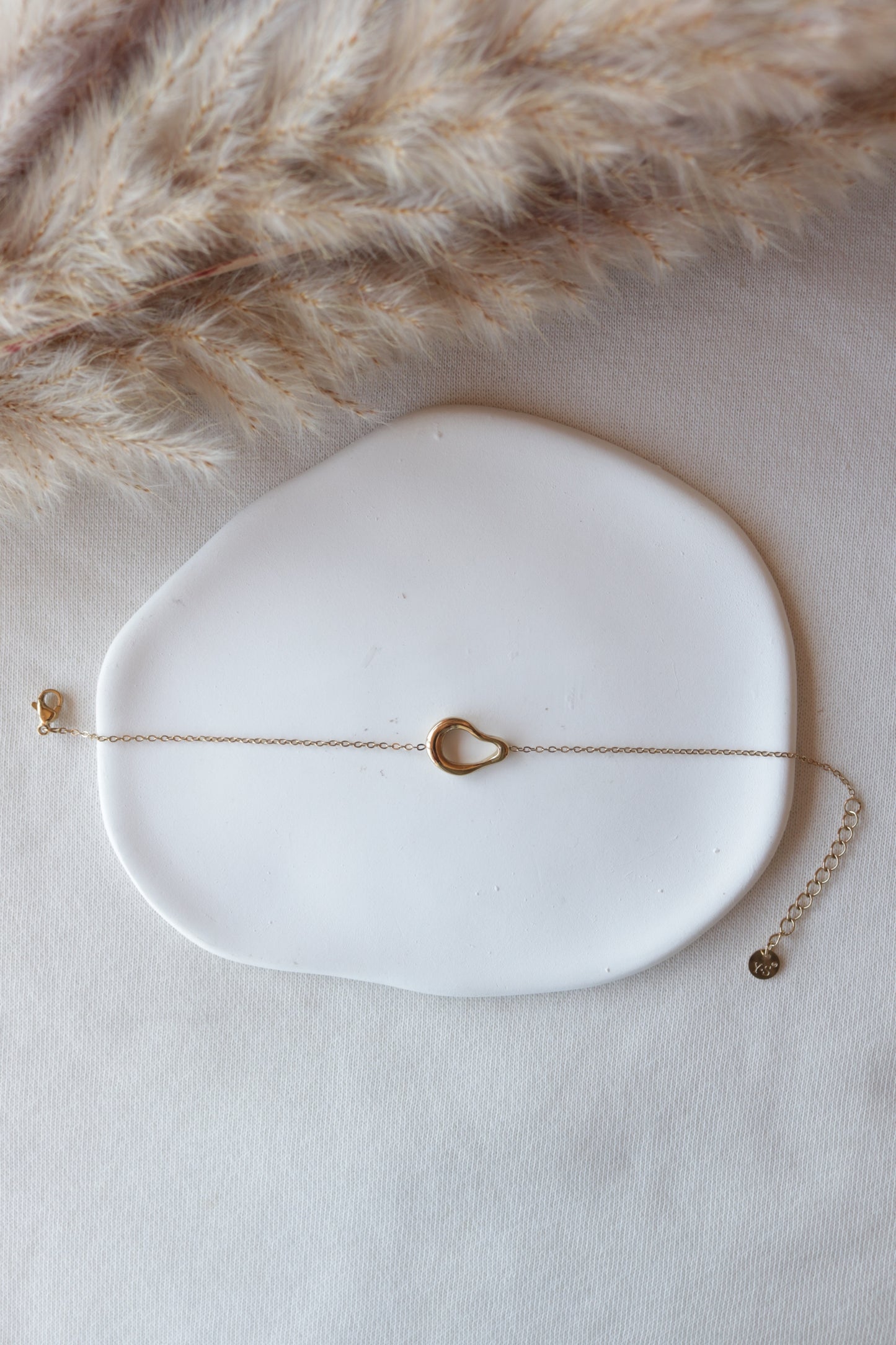 Pulseira de Aço Dourado Oval Irregular