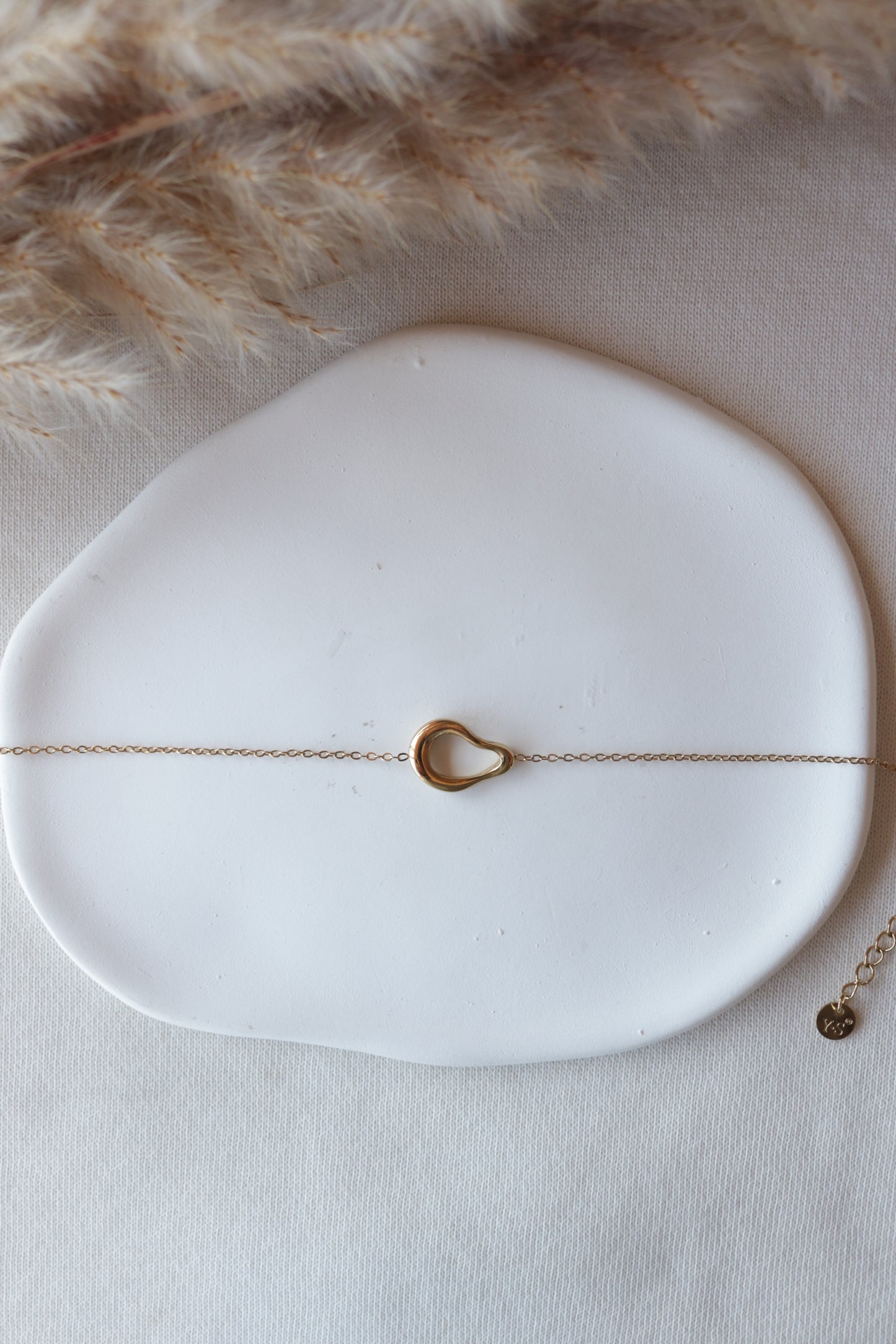 Pulseira de Aço Dourado Oval Irregular