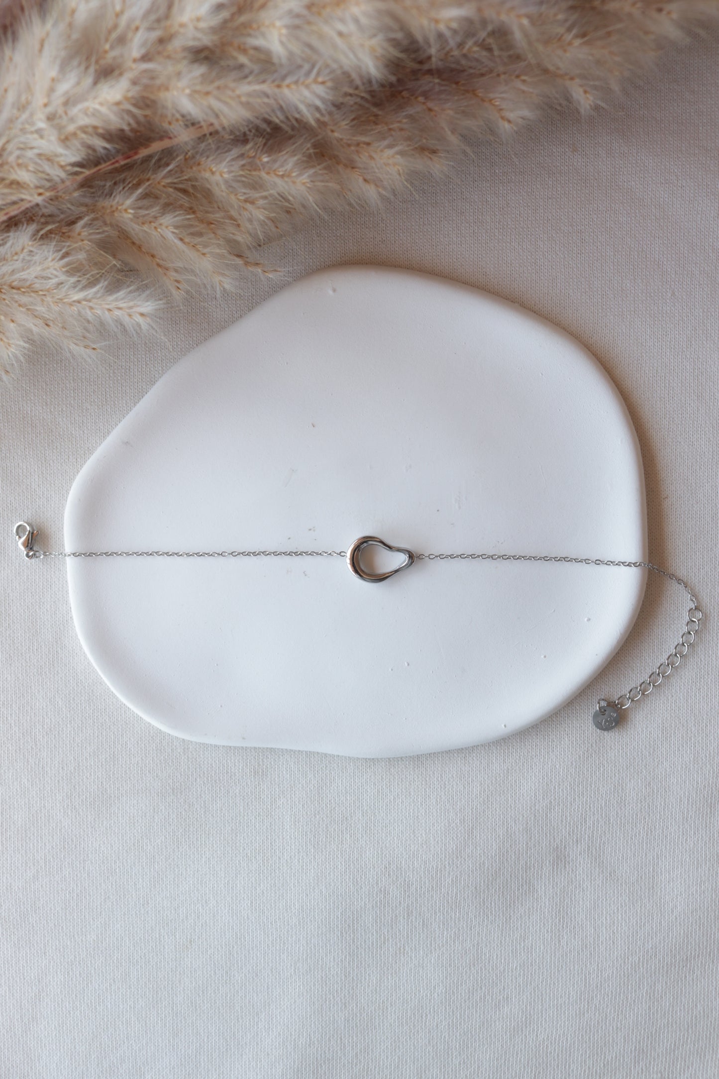 Pulseira de Aço Prateado Oval Irregular