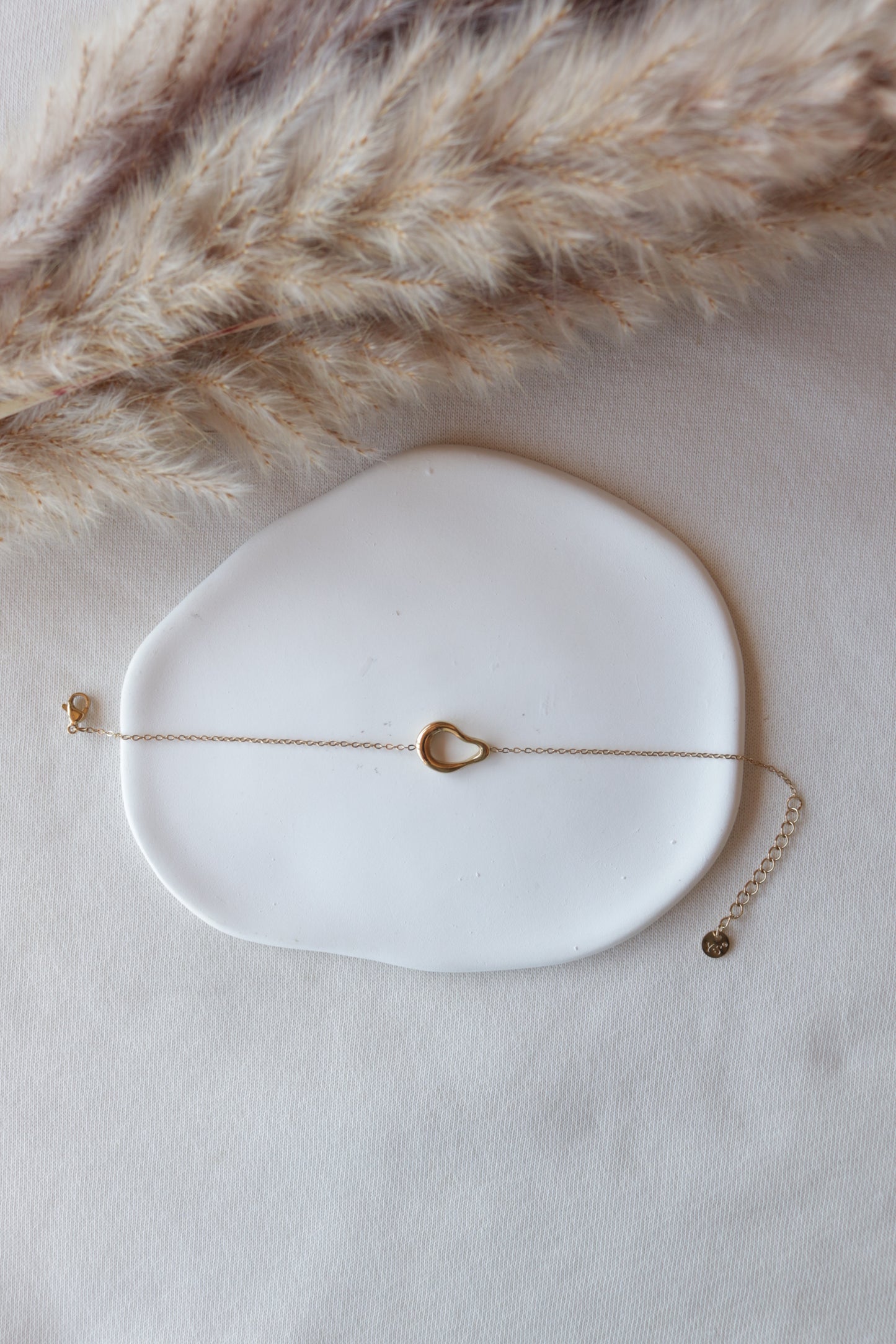 Pulseira de Aço Dourado Oval Irregular