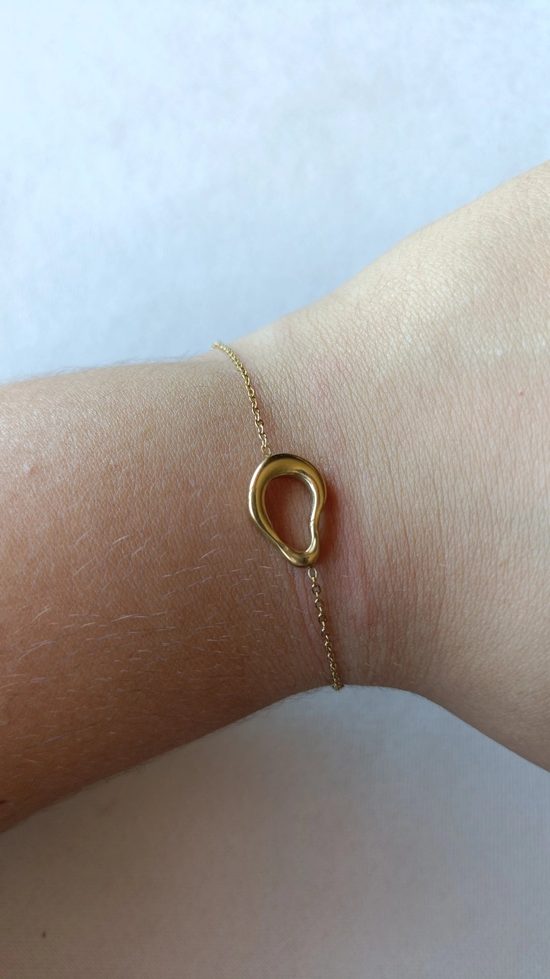 Pulseira de Aço Dourado Oval Irregular