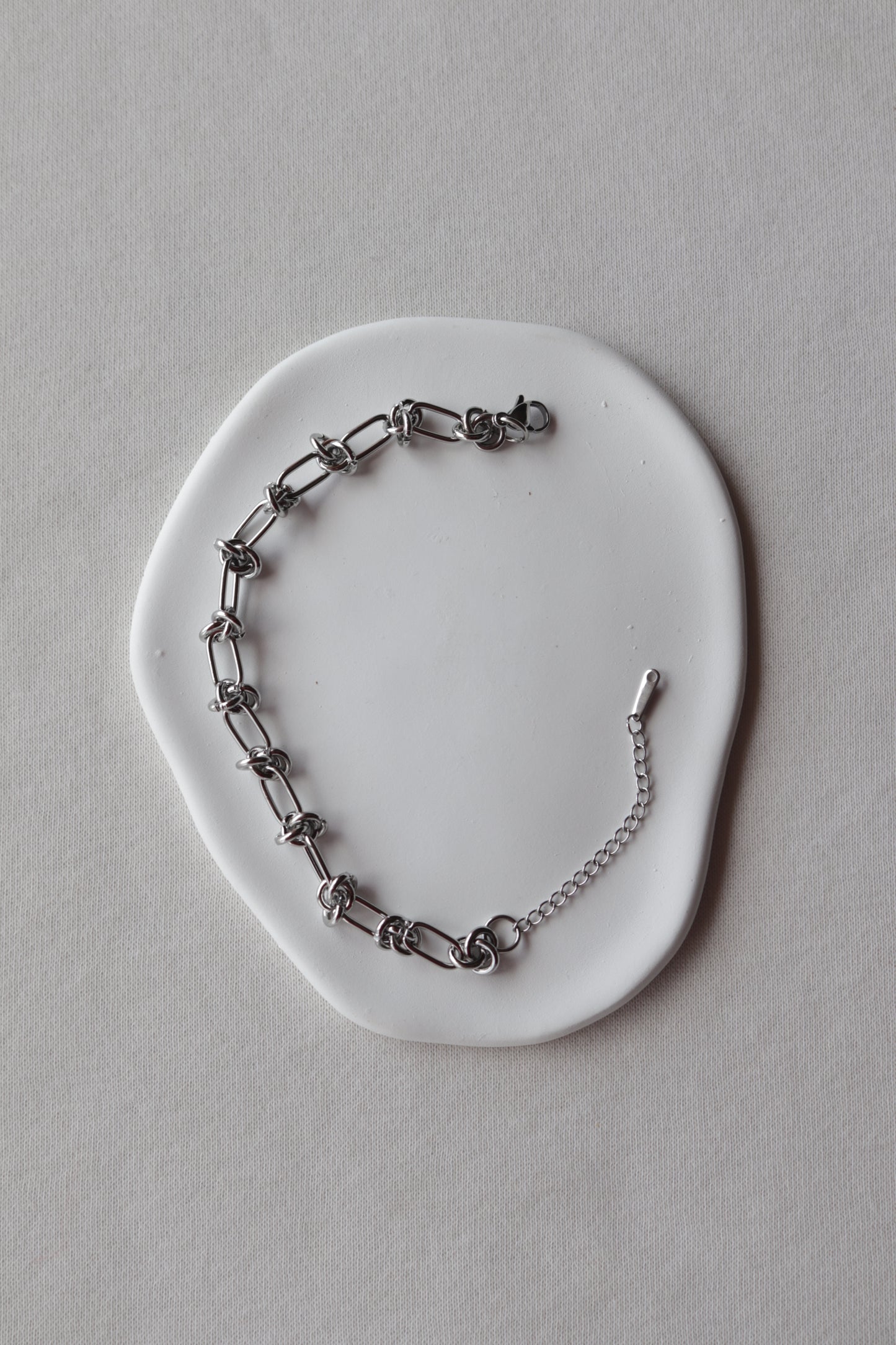 Pulseira de Aço Prateado de Nós