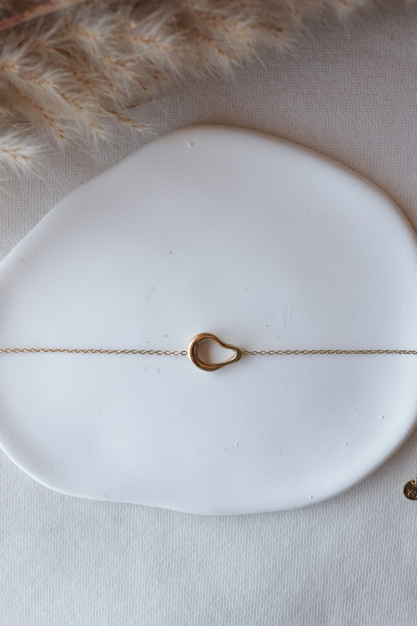 Pulseira de Aço Dourado Oval Irregular