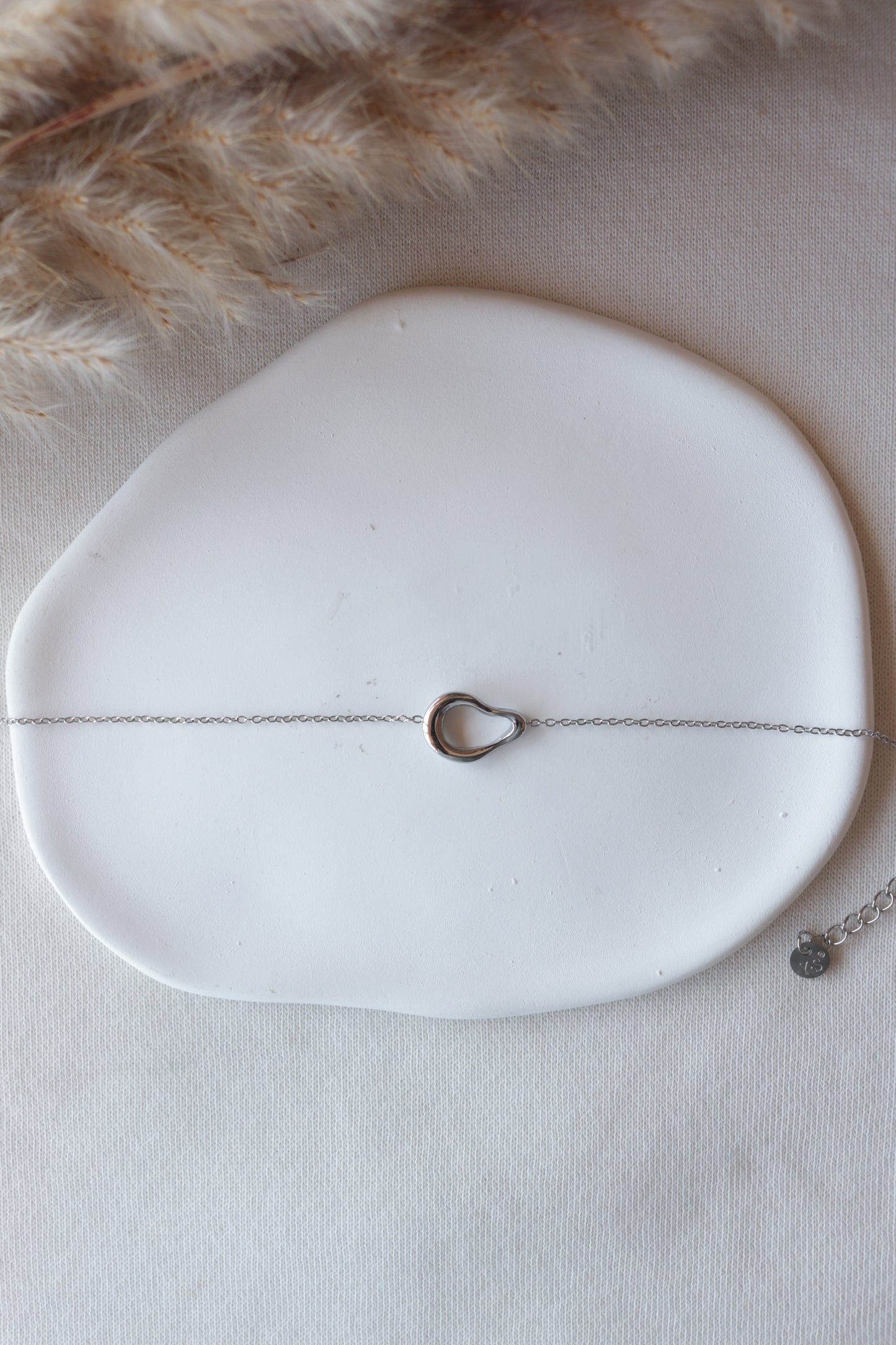 Pulseira de Aço Prateado Oval Irregular