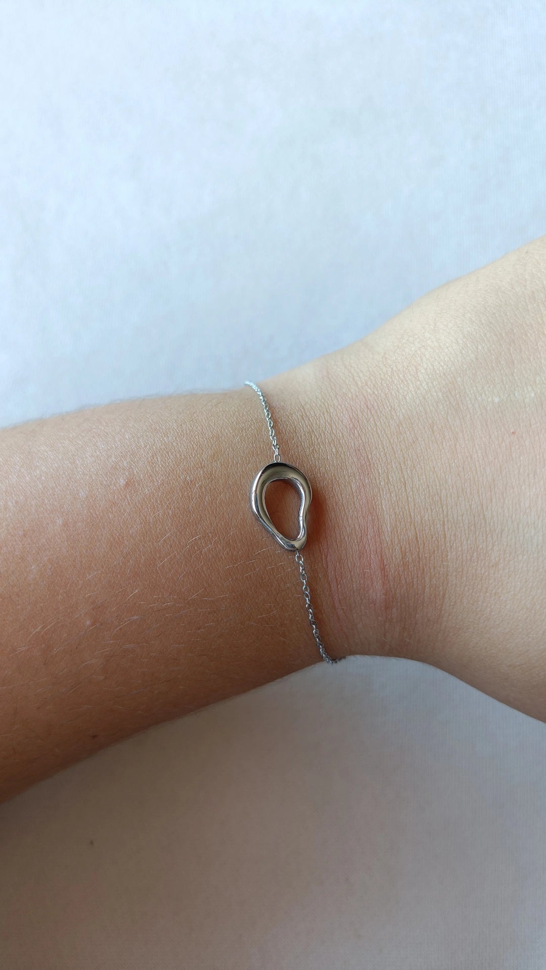 Pulseira de Aço Prateado Oval Irregular