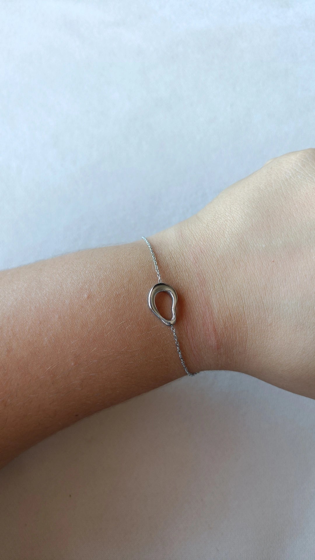 Pulseira de Aço Prateado Oval Irregular