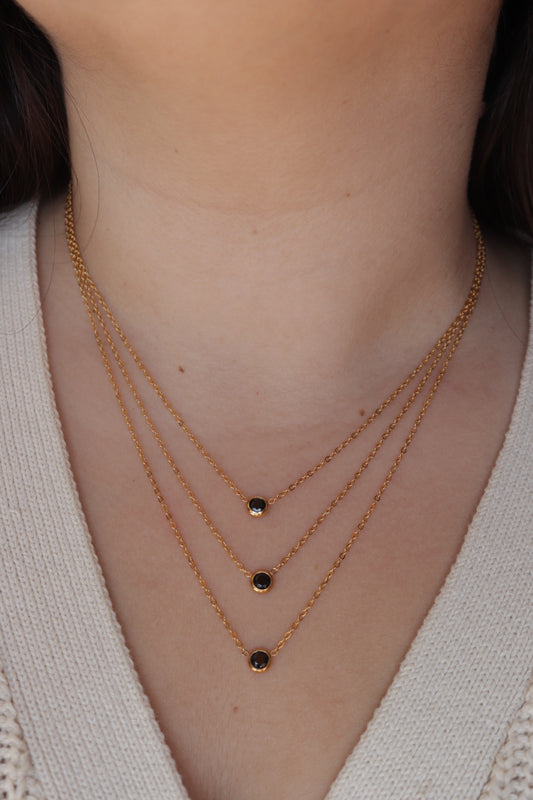 Colar de Aço Dourado Triplo com Zircónias Pretas